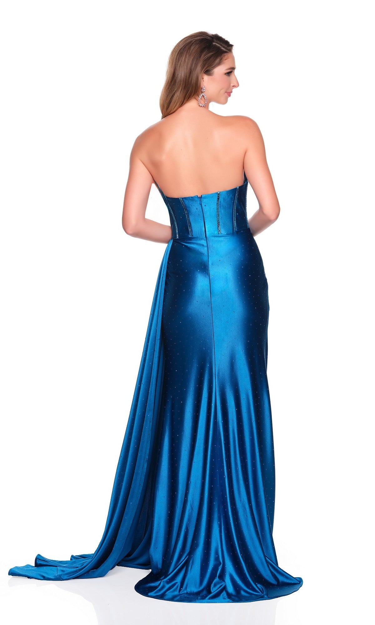 A woman is shown from the back in the Dave and Johnny 12721 long prom dress—a strapless blue satin gown with a corset bodice and floor-length sheath skirt, against a white background.